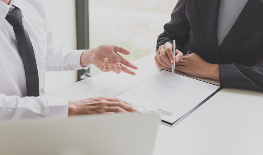 Manager in a job interview with a clipboard