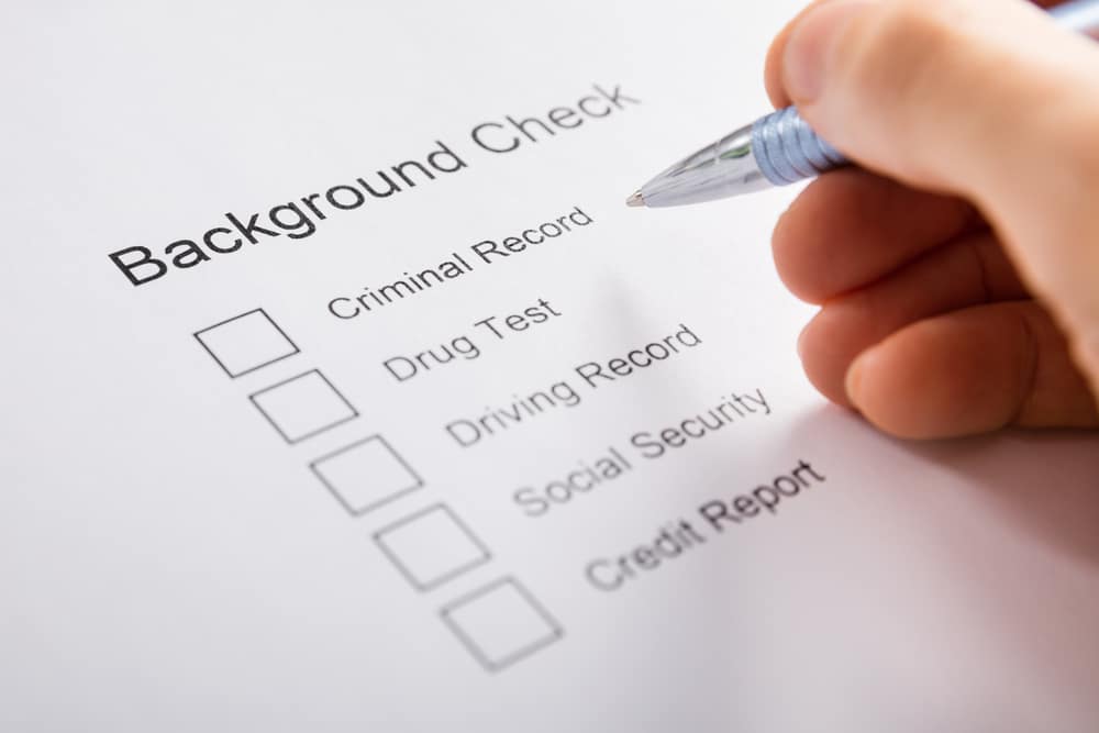 Person filling in paper background check request