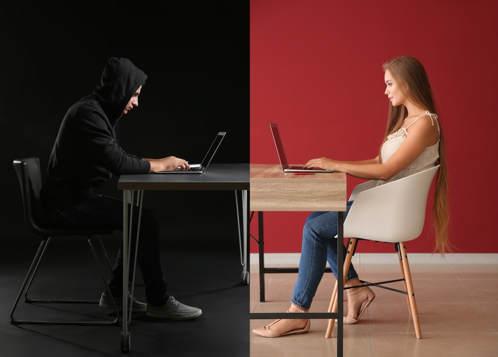 couple on laptops split background