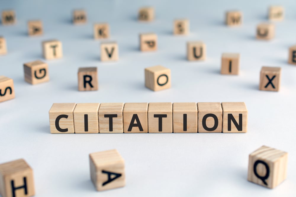 citation spelled in wooden blocks