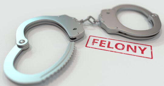 felony next to handcuffs