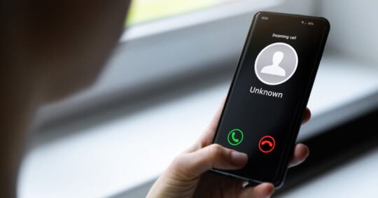 a person receiving an unknown call