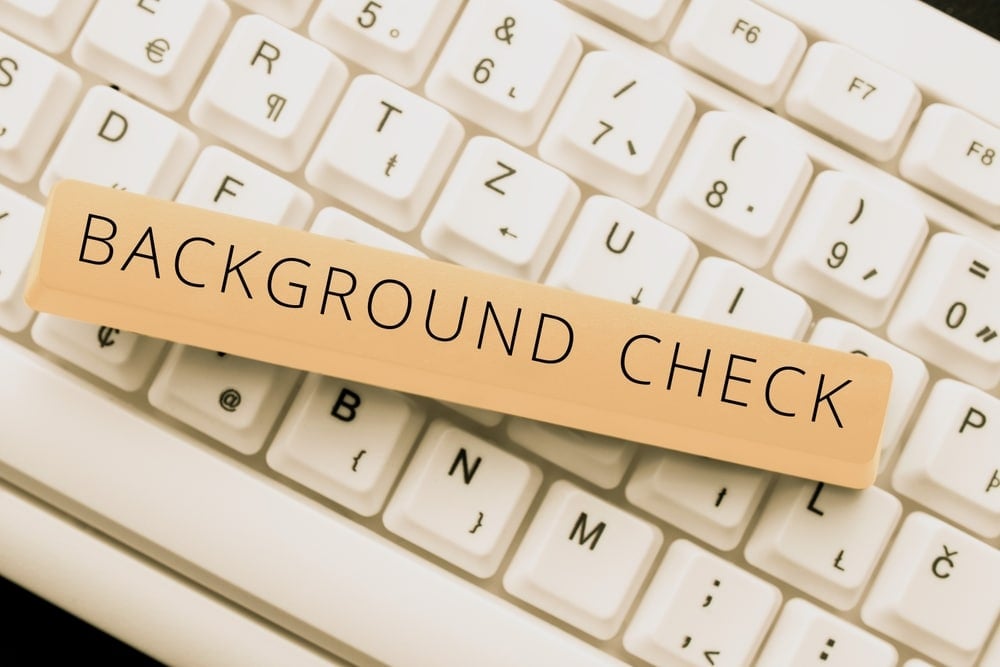 background check text caption on keyboard