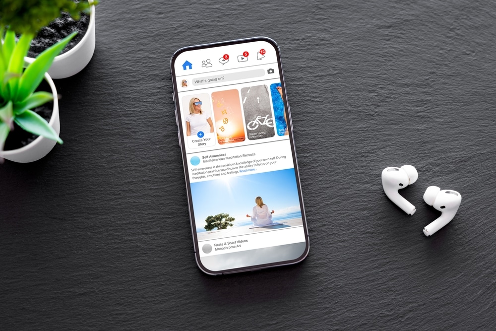 facebook on phone with airpods