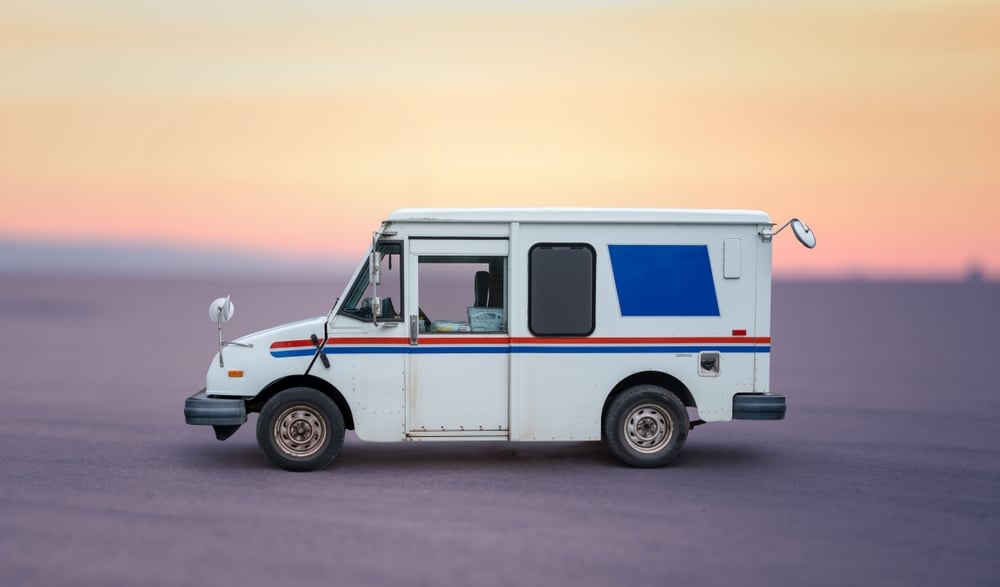 mail delivery truck white and blue